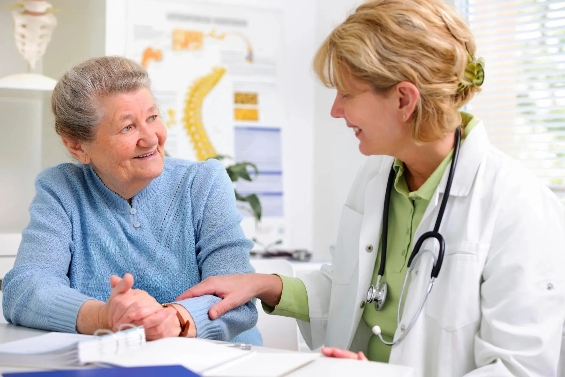 A doctor and patient talking to each other.