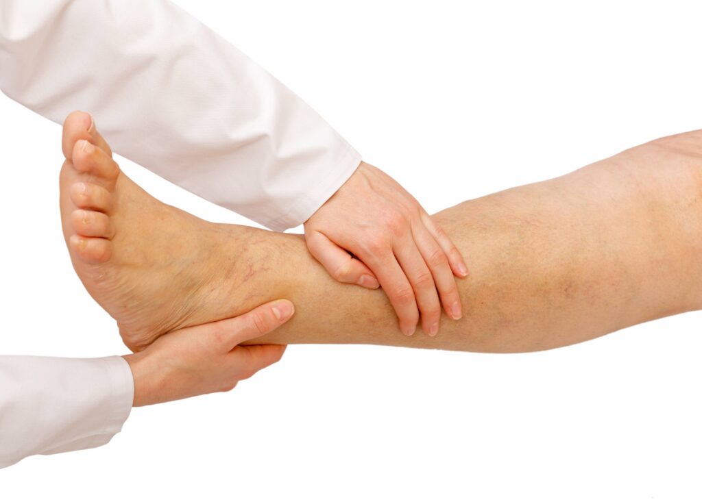 A Person Massaging Another Person’s Foot and Ankle
